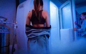 Girl going in cryotherapy chamber
